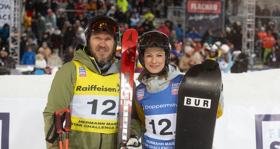 Hermann Maier mit Ski und Christina Stürmer mit Snowboard im Zielbereich | © Snow Space Salzburg / Wildbild