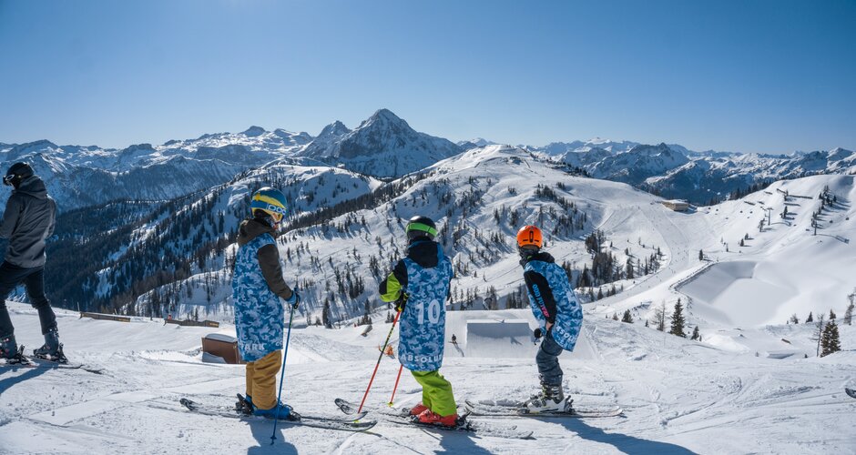 Three freestylers look into the distance at the start of the Absolut Park in cool freestyler clothes  | © Juraj Opalek