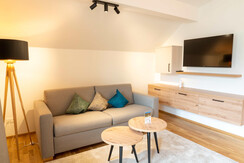 Wohnzimmer mit TV die Unterbergerin Gastein