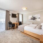 Photo of Bräu-Dreibettzimmer mit Balkon