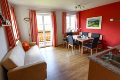 Bright eat-in kitchen with kitchenette, dining area and sofa bed