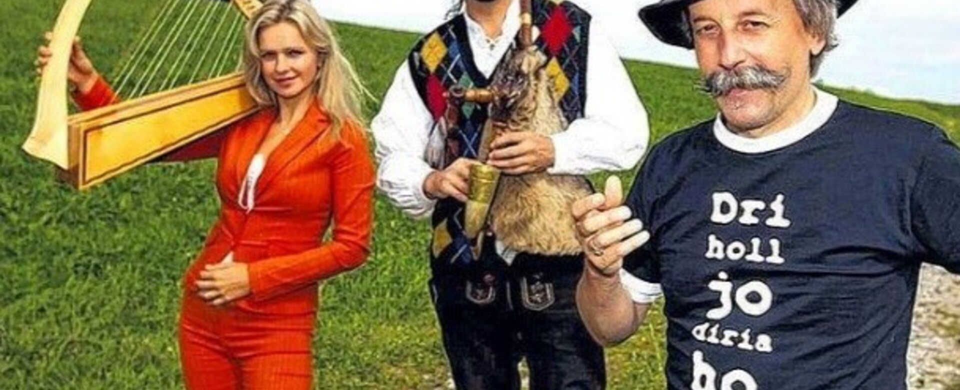 Three people with harp, bagpipes and hats standing in meadow, looking at camera.