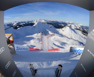 View from the start house of the Ski World Cup women's downhill run, which runs steeply into the snow-covered winter landscape.